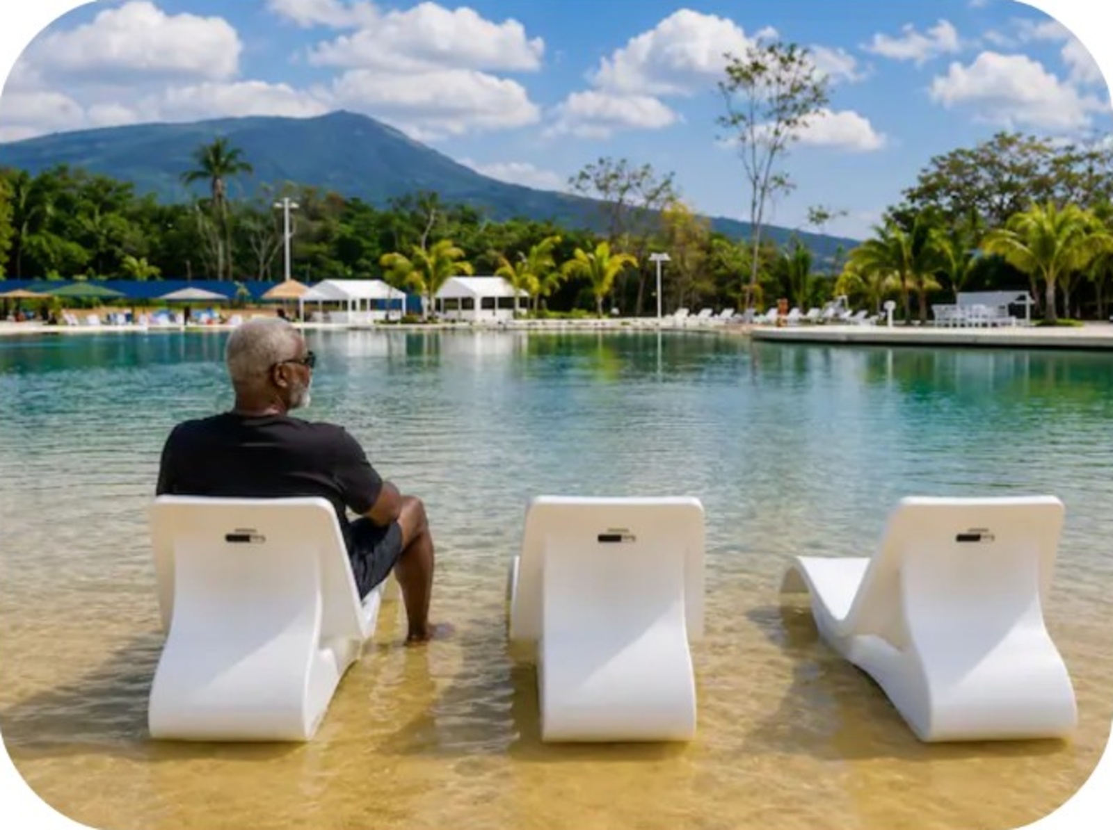 Senior guest relaxing at the saltwater lagoon pool